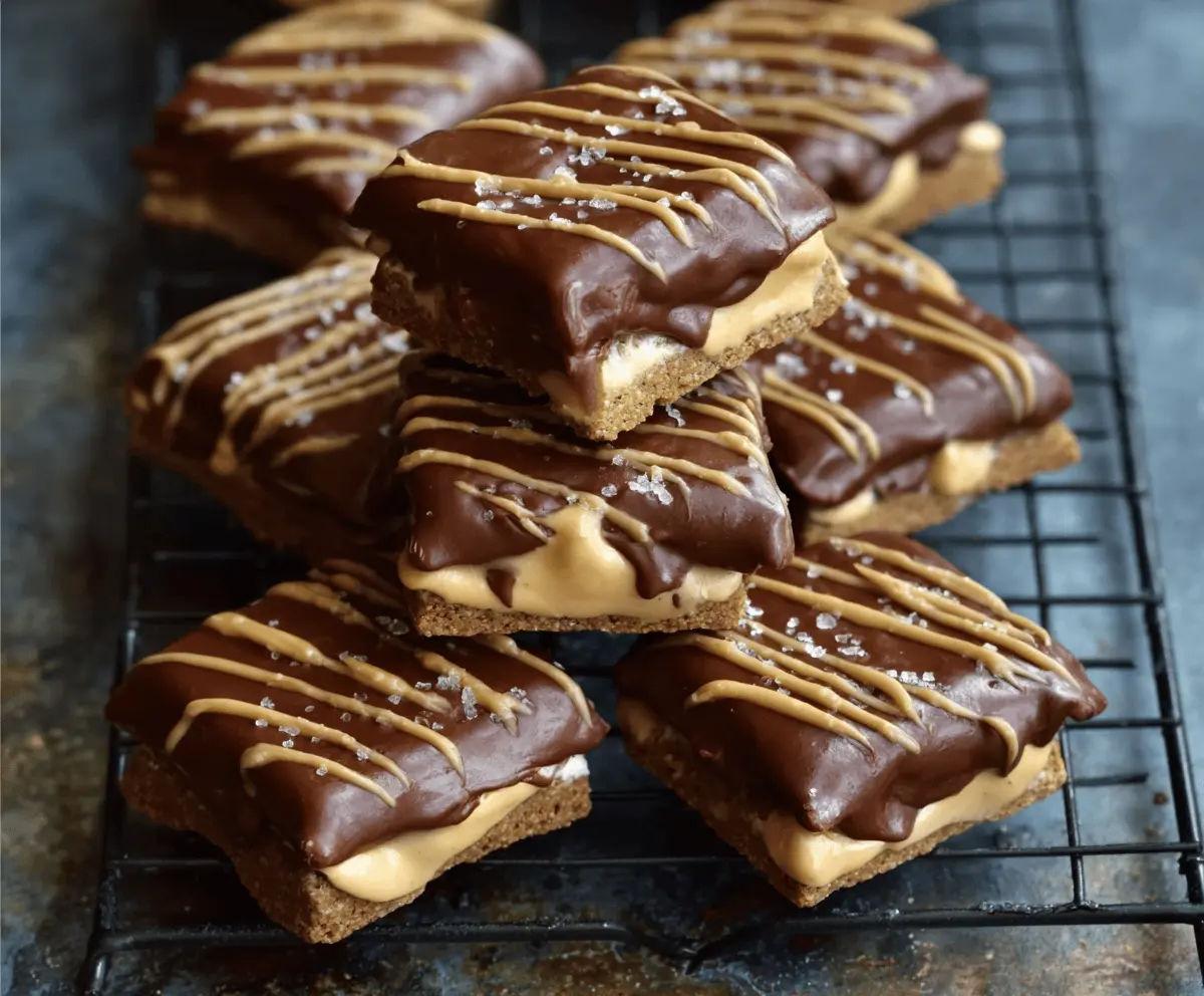 Delicious no-bake buckeye graham crackers topped with creamy peanut butter and chocolate coating, perfect for a sweet snack or dessert
