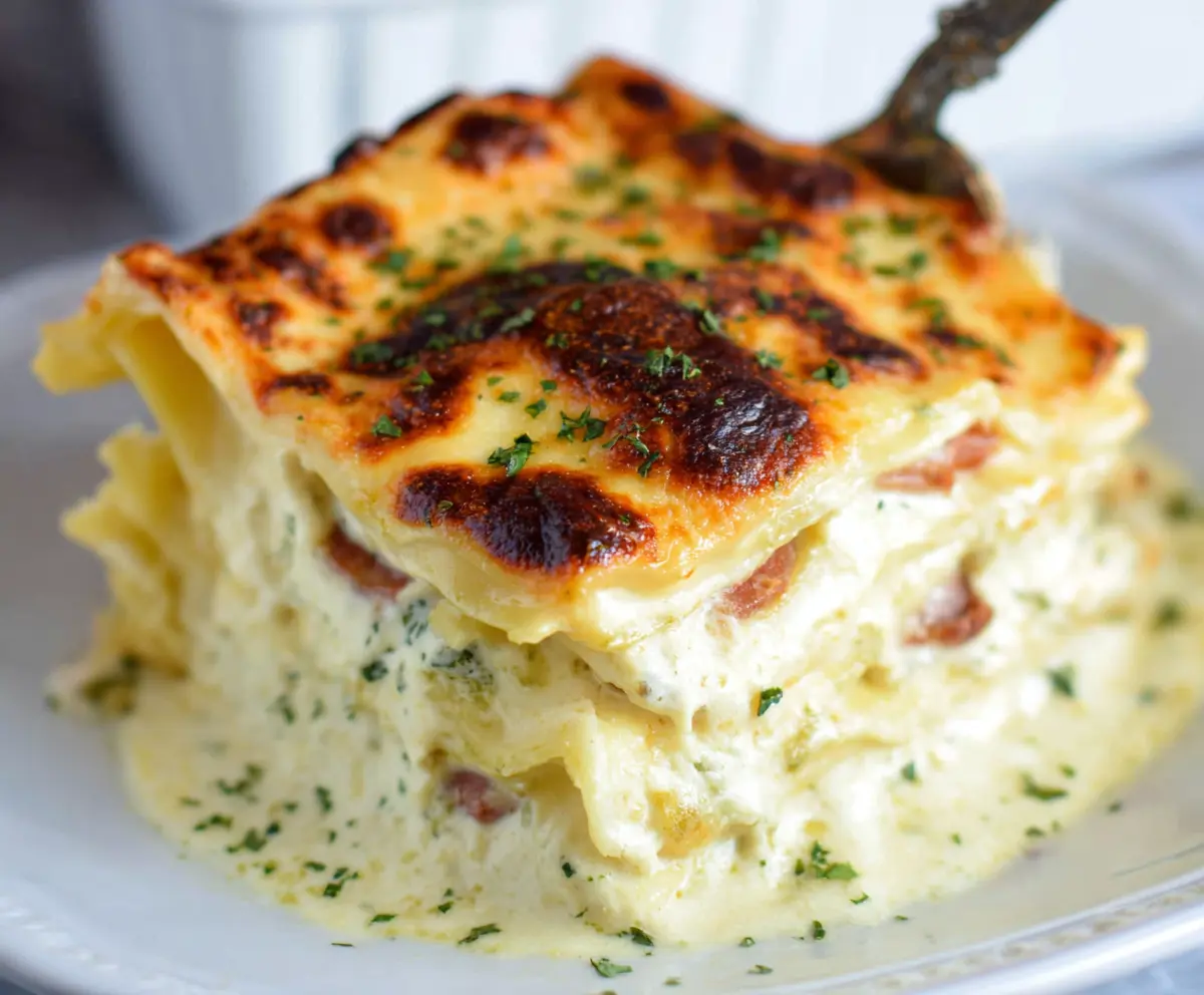 Delicious creamy white lasagna with layers of cheese and tender pasta ready to serve.